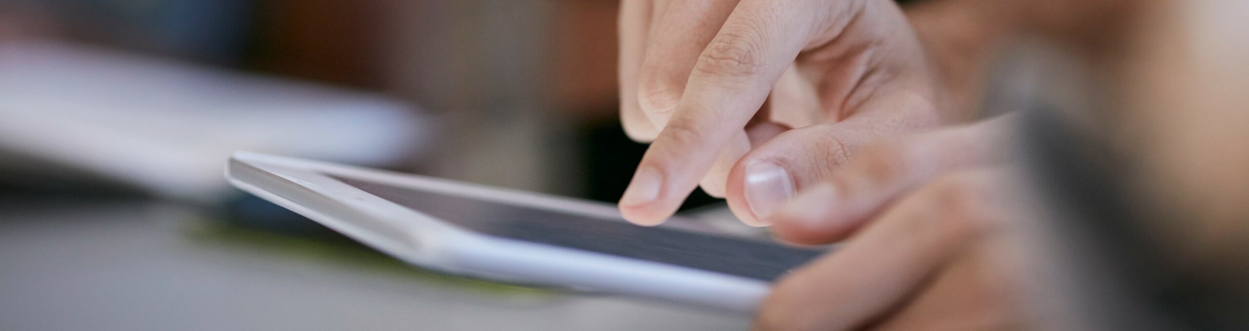 Close Up Of Student Scrolling On Tablet