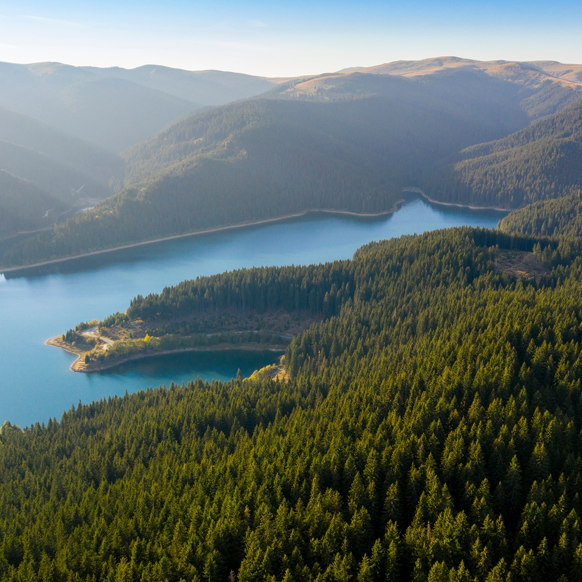 Aerial View Over Beautiful Turquoise Mountain Lake And Green For